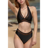Beach Babes cheeky bikini bottoms sporty top in black with mesh details on model at the beach
