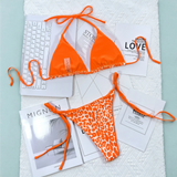 Beach Babes orange cheeky bottom triangle swimsuit with solid top and leopard print bottom