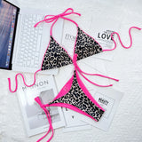 Beach Babes cheeky bottom triangle swimsuit with leopard print and bright pink trim on a white surface