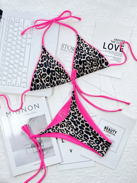 Beach Babes cheeky bottom triangle swimsuit with leopard print and bright pink trim on a white surface