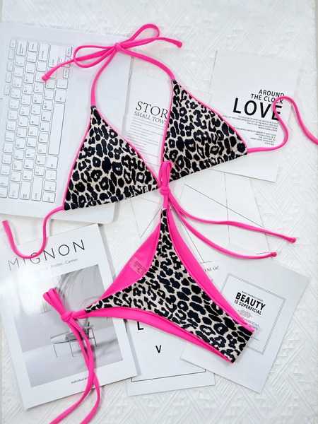 Beach Babes cheeky bottom triangle swimsuit with leopard print and pink trim laid out on white surface