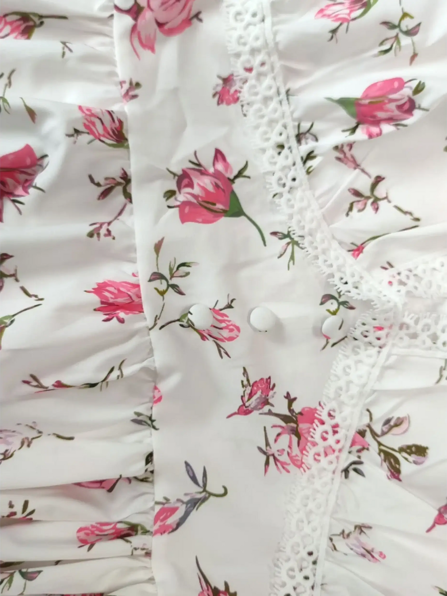 Close up of fabric mini dress with pink floral print and lace trim perfect chic beachwear dresses for curvy women