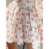 Image showing pleats floral mini dress featuring pink roses perfect as chic beachwear dresses for curvy women