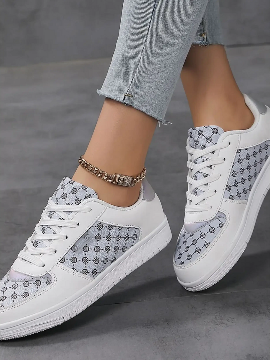 Trendsi chic beachwear sneakers in white with gray patterned panels worn with light wash jeans