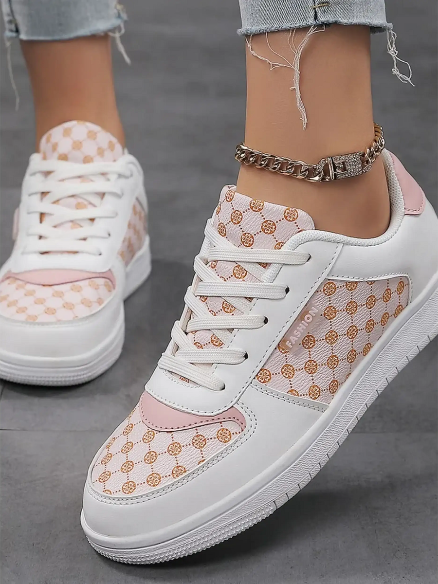 Trendsi chic beachwear sneakers in white and pink with patterned panels worn with light denim jeans
