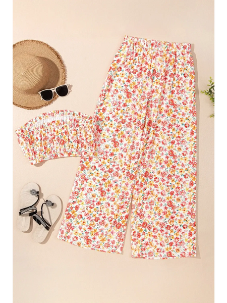 Trendsi chic boho beachwear set with floral print pants and matching top laid flat with hat and sunglasses