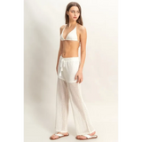 Trendsi chic cover up set for poolside featuring white crochet halter top and matching sheer pants
