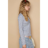 Trendsi chic long sleeve beachwear shirt in light blue with floral print worn by model
