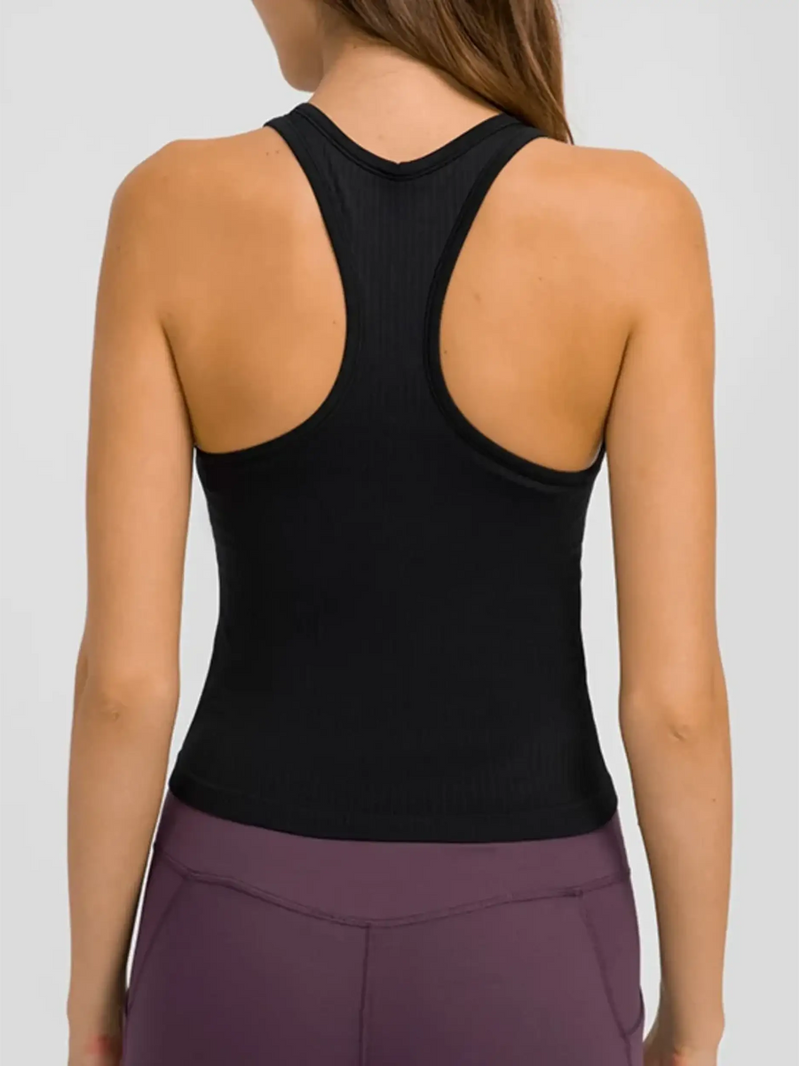 Trendsi black chic racerback yoga tank for women shown from the back with purple leggings