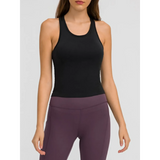 Trendsi black chic racerback yoga tank for women paired with purple leggings