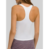 White chic racerback yoga tank for women by Trendsi shown from back with purple leggings