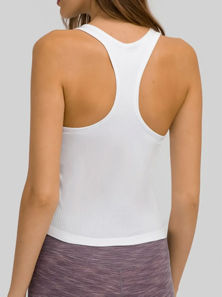 White chic racerback yoga tank for women by Trendsi shown from back with purple leggings