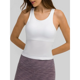 Trendsi chic racerback yoga tank for women in white ribbed fabric paired with purple leggings