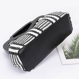 Black and white patterned chic resort evening handbags with unique handle design by Babe Beachwear