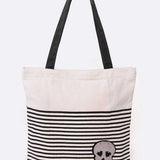 Babe Beachwear chic skull design resort bag with black and white stripes and black handles
