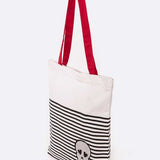 Babe Beachwear chic skull design resort bag with black stripes and red shoulder straps