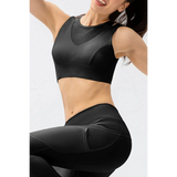 Babe Beachwear black chic summer exercise crop top active tank worn by smiling woman posing