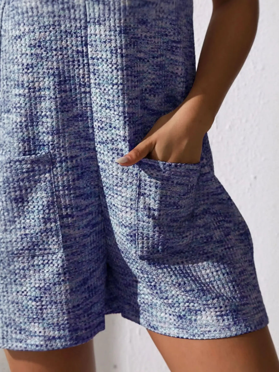 Close-up of chic summer leisurewear romper in blue textured fabric with front pocket detail