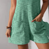 Babe Beachwaer chic summer leisurewear romper in textured green fabric with front pockets