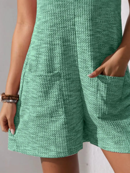 Babe Beachwaer chic summer leisurewear romper in textured green fabric with front pockets