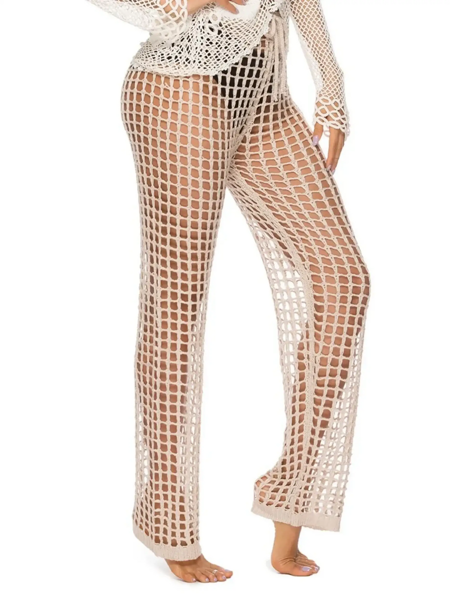 Beach Babes beige mesh swim shorts styled as chic swimsuit cover up pants on model