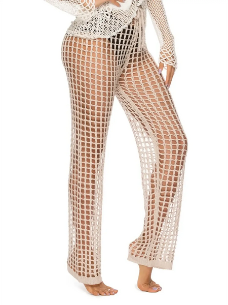 Beach Babes beige mesh swim shorts styled as chic swimsuit cover up pants on model