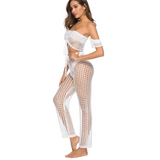Beach Babes white chic swimsuit cover up pants with open net design worn by a woman