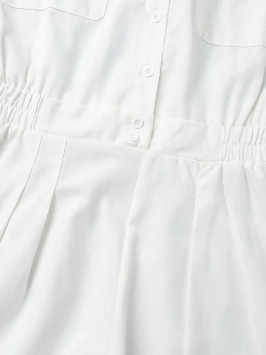 Close-up of white Classy Long Sleeve Romper showing button details and waist elastic from Trendsi