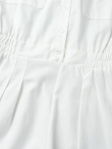 Close-up of white Classy Long Sleeve Romper showing button details and waist elastic from Trendsi
