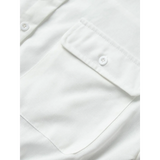 Close-up of white fabric pocket with button detail on a Classy Long Sleeve Romper by Trendsi