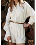 Trendsi classy long sleeve romper in cream with front pockets and a brown belt