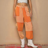 Orange patchwork pants with drawstring pocketed contrast for a standout casual look