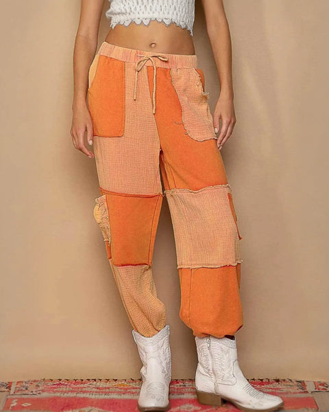 Orange patchwork pants with drawstring pocketed contrast for a standout casual look