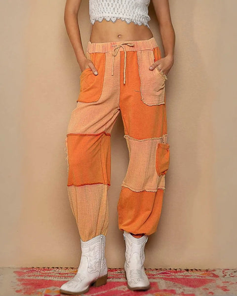 Orange patchwork pants with drawstring pocketed contrast for a trendy look