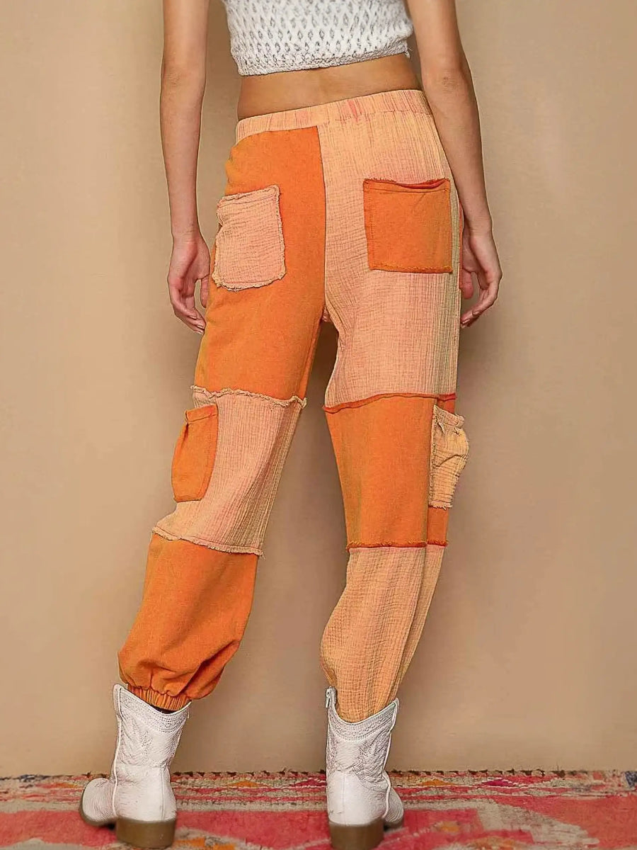 Patchwork orange pants with drawstring pocketed contrast for a standout style
