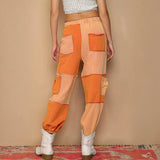 Patchwork orange pants with drawstring pocketed contrast for a standout style