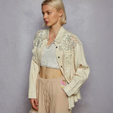 Woman wearing a vintage inspired beige lace shirt and crop top, perfect lightweight summer style