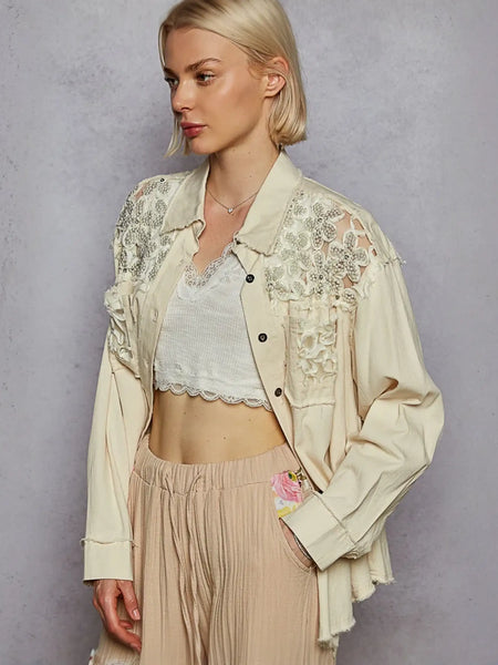 Woman wearing a vintage inspired beige lace shirt and crop top, perfect lightweight summer style