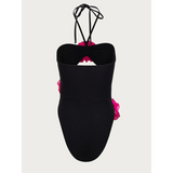 Beach Babes color-block one piece bathing suit in black with pink ruffle details and halter straps