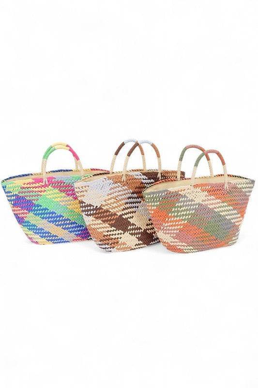 Colorful straw beach tote bag by Babe Beachwear in vibrant and earthy striped patterns