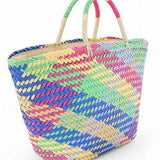 Colorful straw beach tote bag by Babe Beachwear with vibrant woven pattern and dual handles