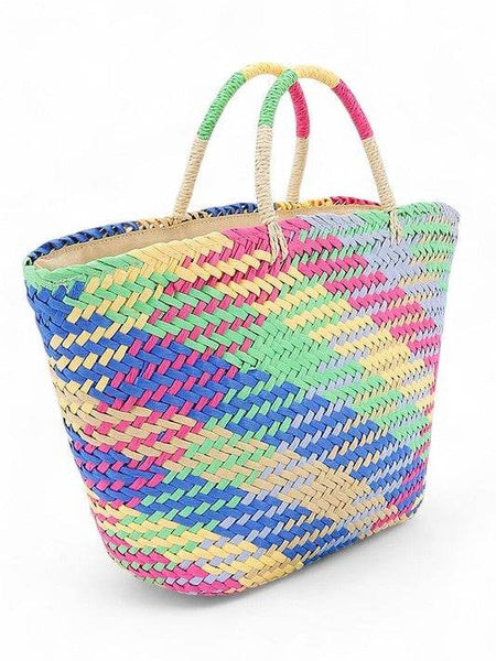 Colorful straw beach tote bag by Babe Beachwear with vibrant woven pattern and dual handles
