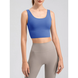 Babe Beachwaer blue active tank top worn by woman, a comfortable summer exercise tank for workouts