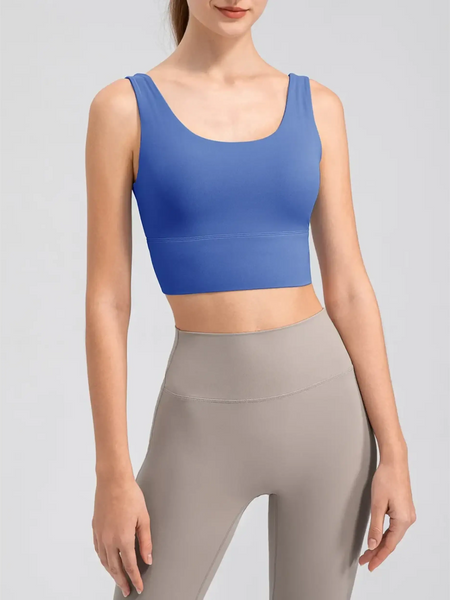 Babe Beachwaer blue active tank top worn by woman, a comfortable summer exercise tank for workouts