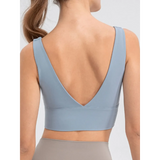 Back view of Babe Beachwear comfortable summer exercise tank in light blue with deep V-cut and wide straps