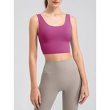 Babe Beachwaer comfortable summer exercise tank in purple worn by a woman with gray leggings
