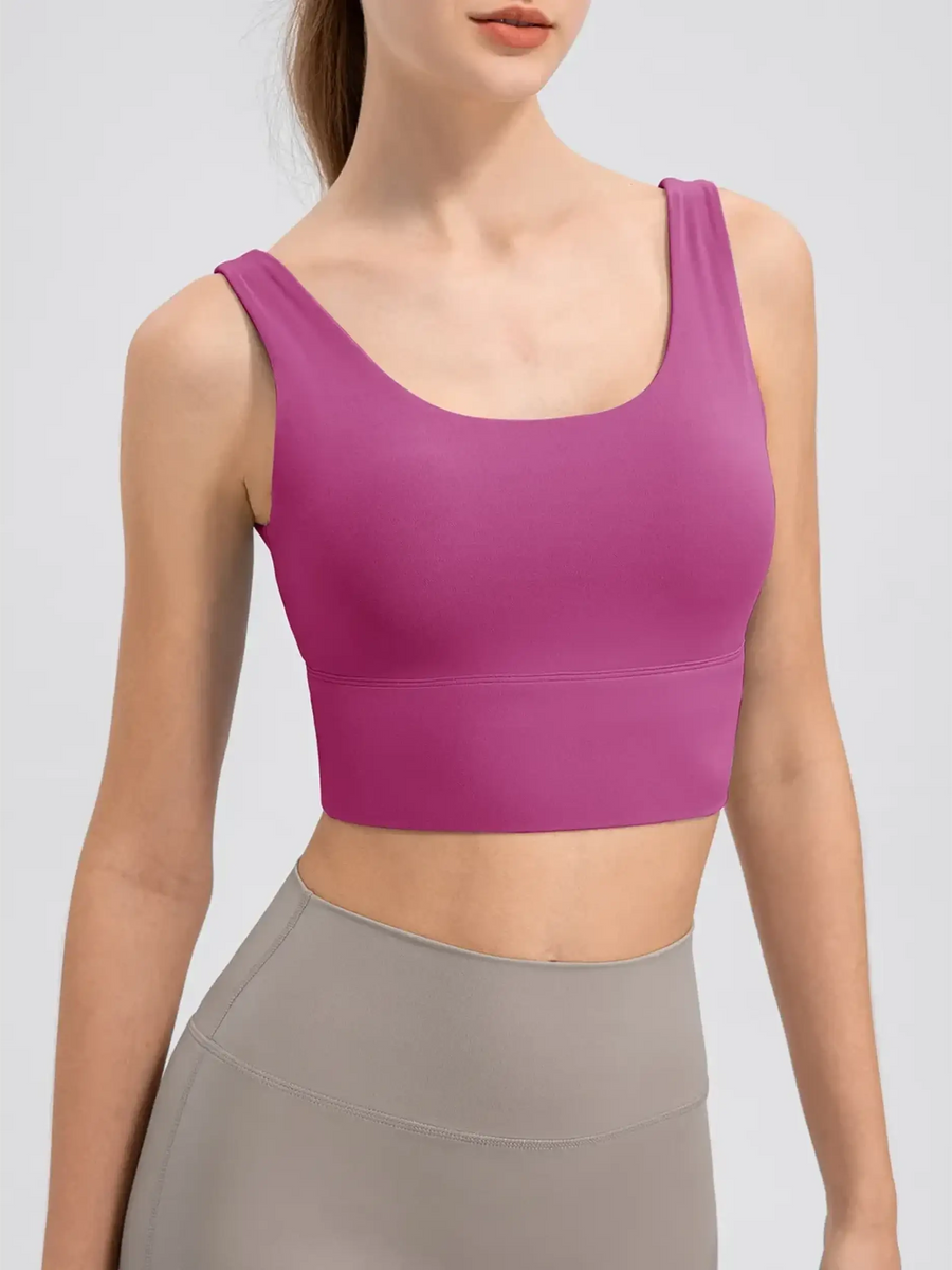 Babe Beachwear comfortable summer exercise tank in pink worn with high-waisted workout leggings