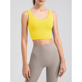Babe Beachwear yellow active tank top worn with grey leggings comfortable summer exercise tank