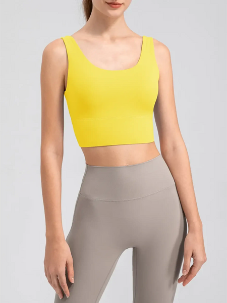 Babe Beachwear yellow active tank top worn with grey leggings comfortable summer exercise tank