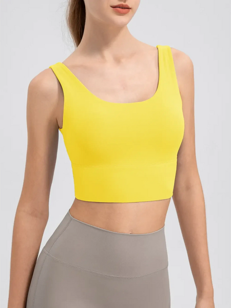 Babe Beachwear yellow comfortable summer exercise tank worn with high-waisted gray leggings